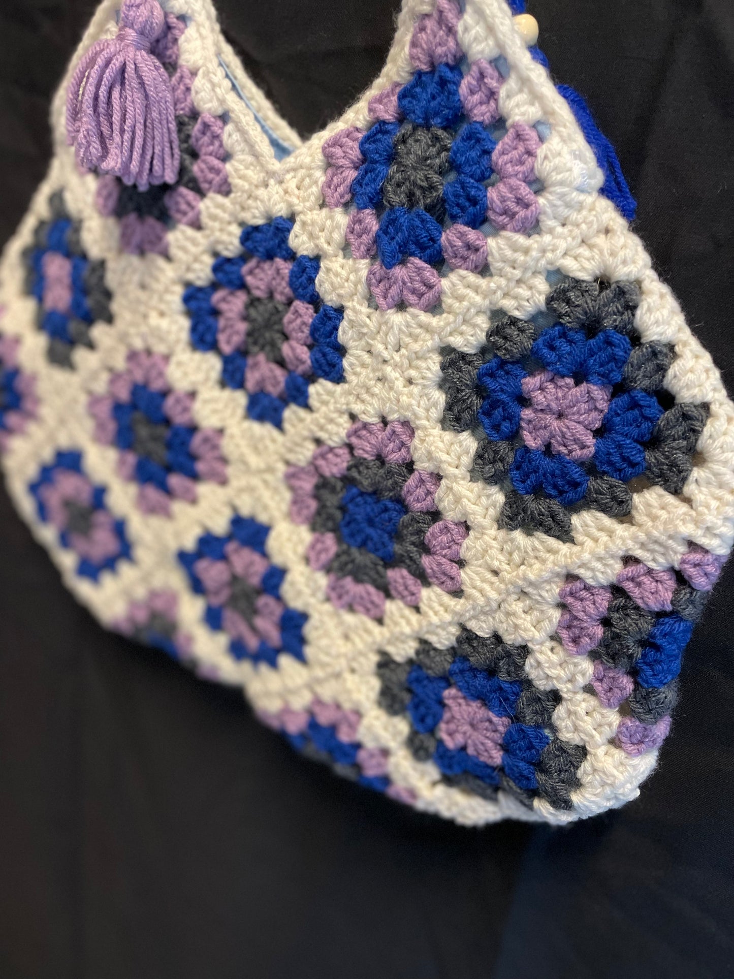 The Royal Elsa crochet Granny Square purse. Made with Upcycled materials for the perfect combination of retro, regal, & sustainable fashion