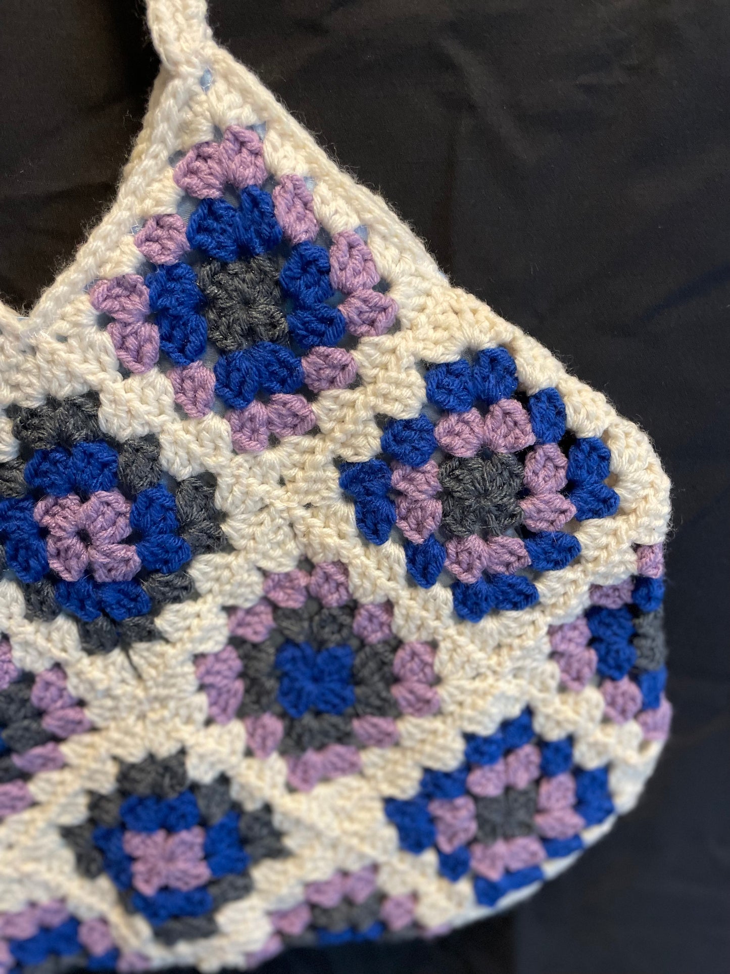 The Royal Elsa crochet Granny Square purse. Made with Upcycled materials for the perfect combination of retro, regal, & sustainable fashion