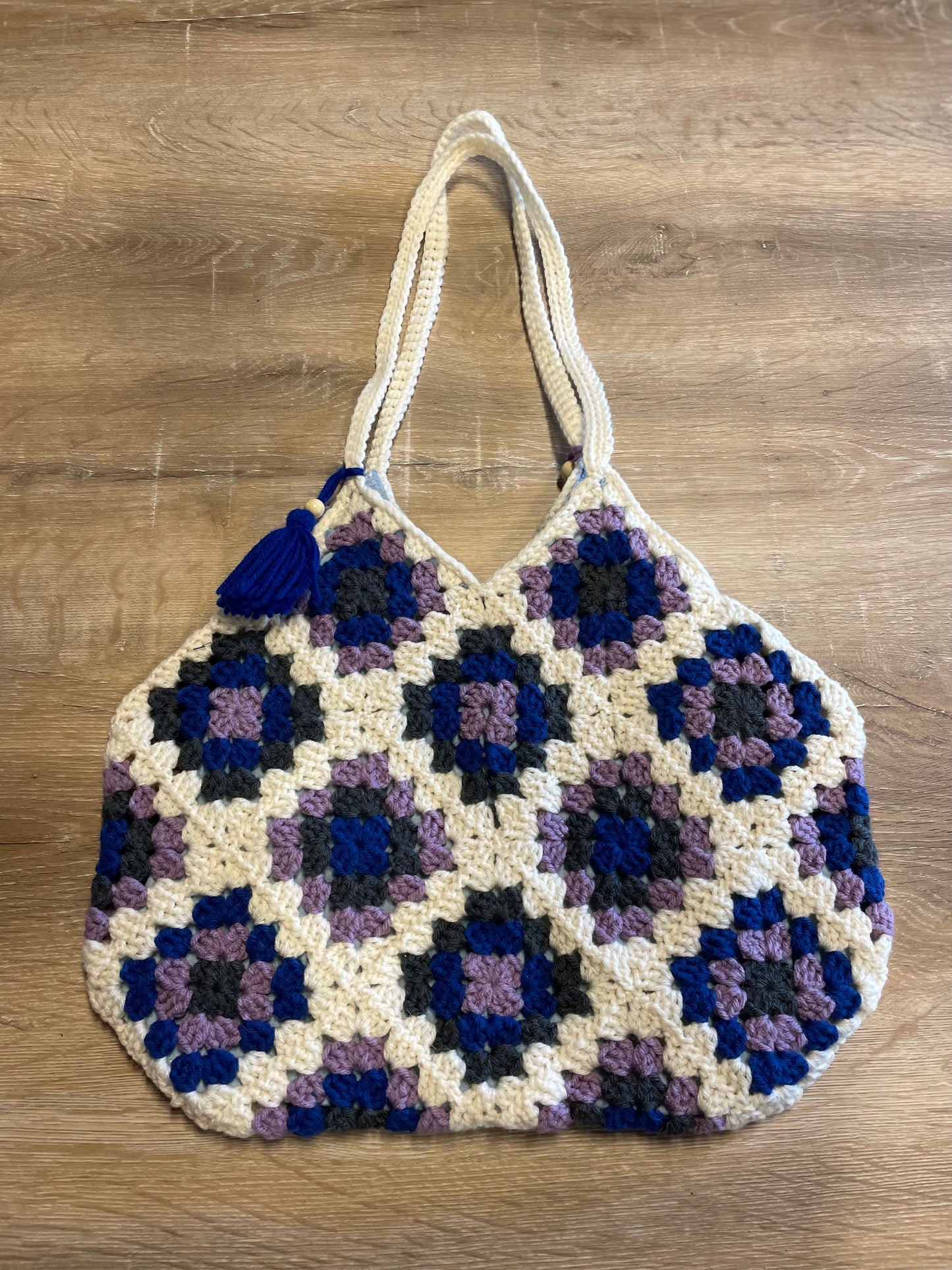 The Royal Elsa crochet Granny Square purse. Made with Upcycled materials for the perfect combination of retro, regal, & sustainable fashion