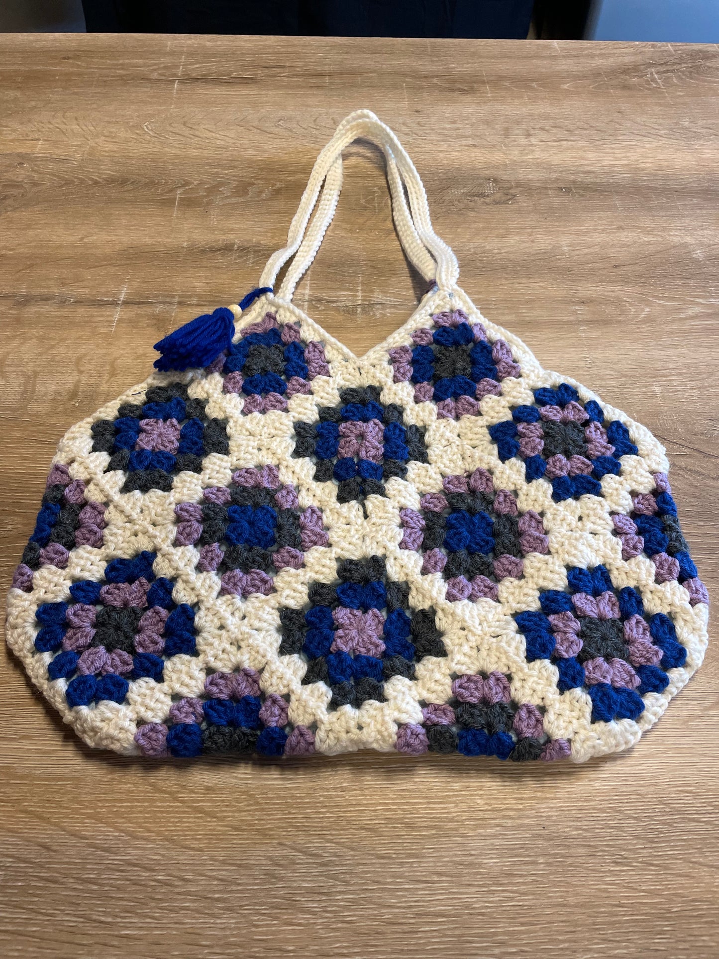 The Royal Elsa crochet Granny Square purse. Made with Upcycled materials for the perfect combination of retro, regal, & sustainable fashion