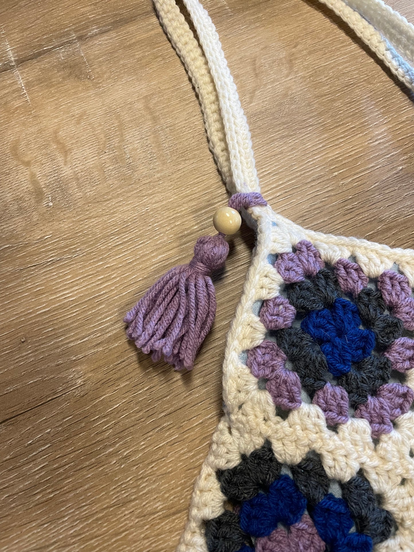 The Royal Elsa crochet Granny Square purse. Made with Upcycled materials for the perfect combination of retro, regal, & sustainable fashion
