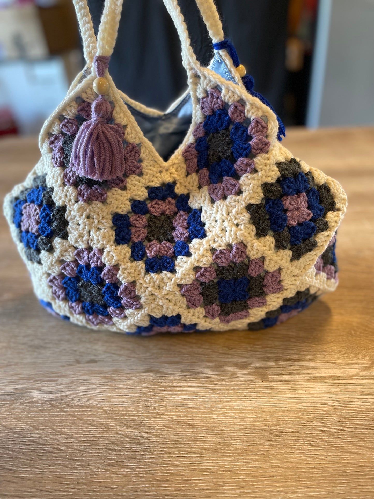 The Royal Elsa crochet Granny Square purse. Made with Upcycled materials for the perfect combination of retro, regal, & sustainable fashion