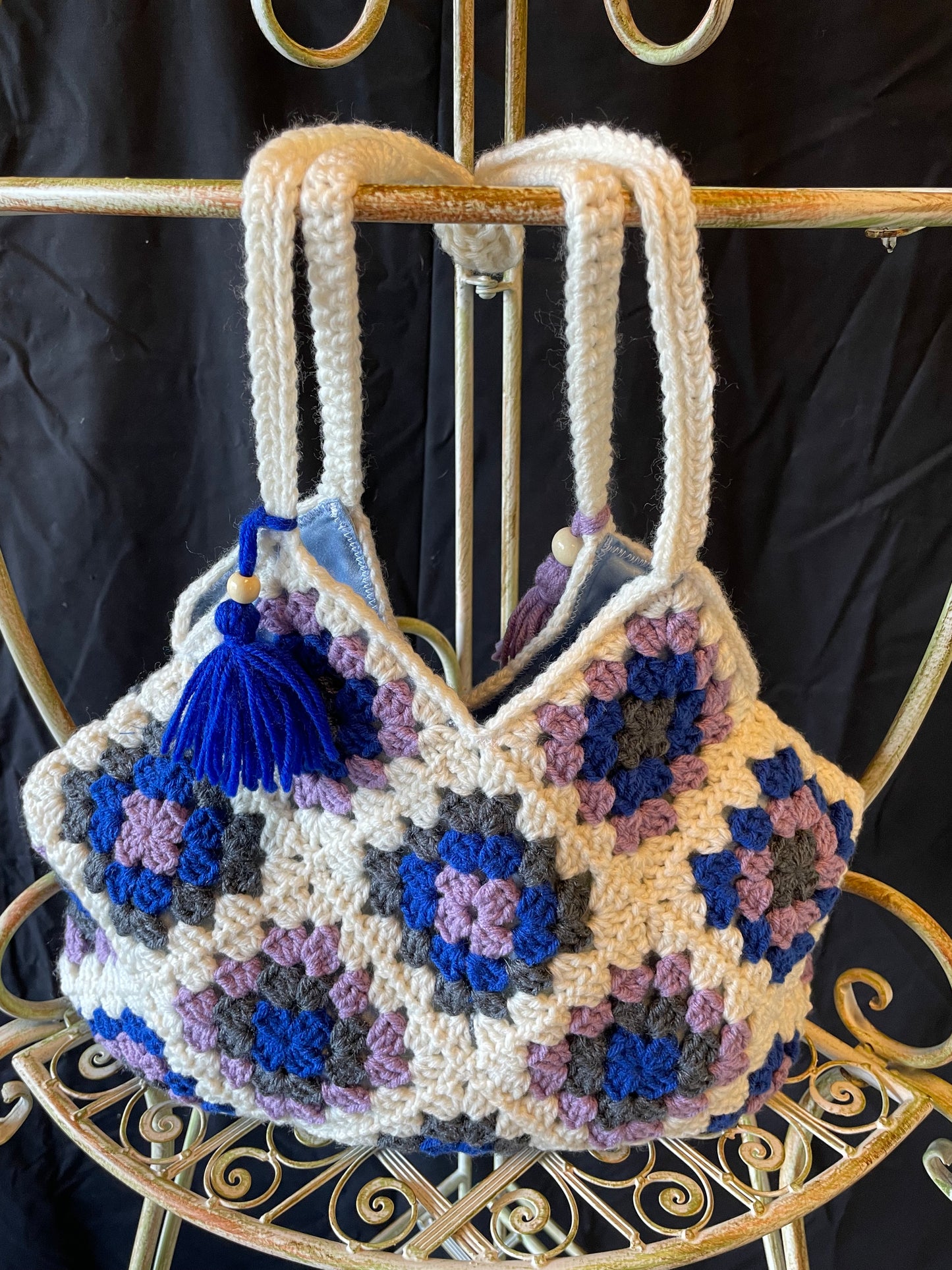 The Royal Elsa crochet Granny Square purse. Made with Upcycled materials for the perfect combination of retro, regal, & sustainable fashion
