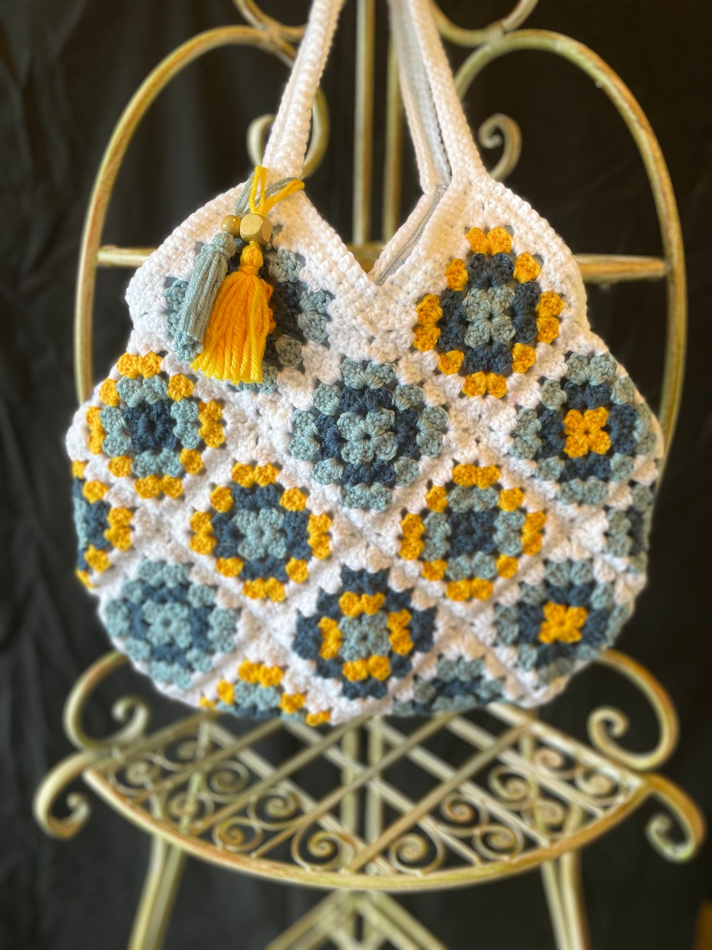 Farmhouse style, eco-friendly crochet granny square purse. 70s vintage charm featuring upcycled materials and stylish sustainable design
