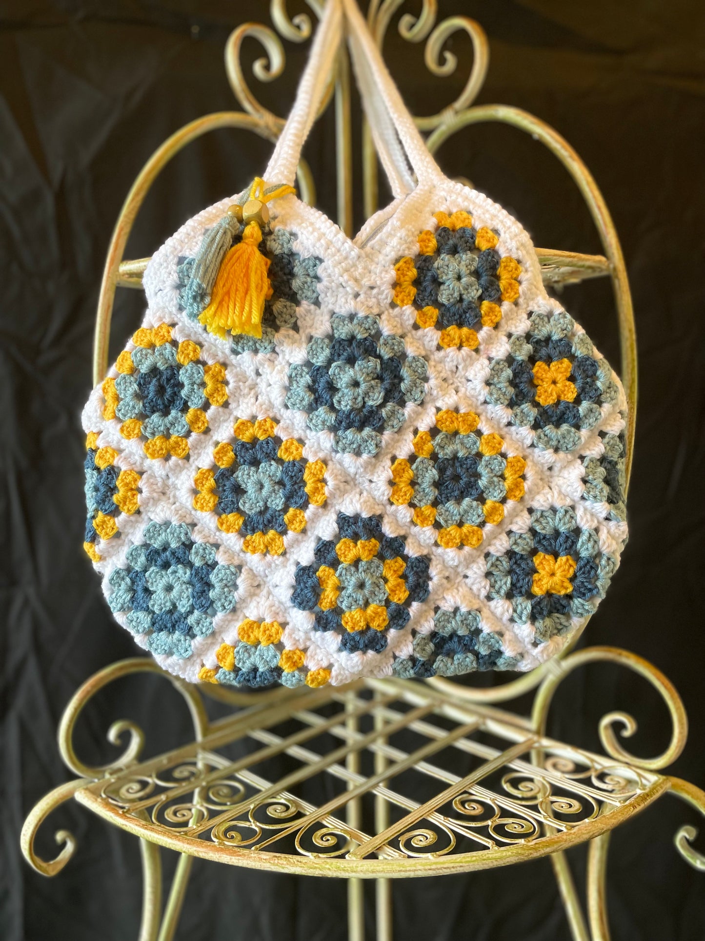 Farmhouse style, eco-friendly crochet granny square purse. 70s vintage charm featuring upcycled materials and stylish sustainable design